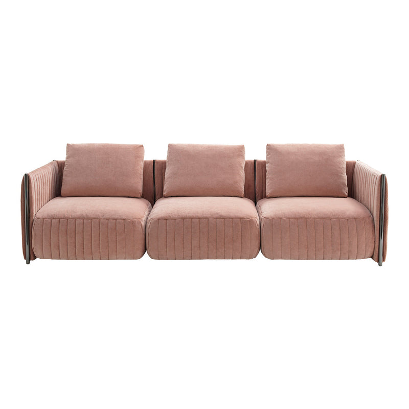Soft blush pink sofa with a ribbed texture and sleek arm design, perfect for modern living spaces.
