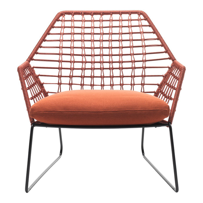 Rust orange cushion with woven coral and black metal frame in a geometric hexagonal pattern. Stylish modern accent chair.