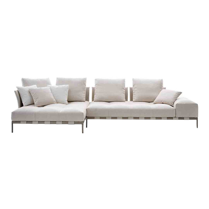Luxury beige sectional sofa with white accent pillows and a minimalist design, perfect for modern interiors.