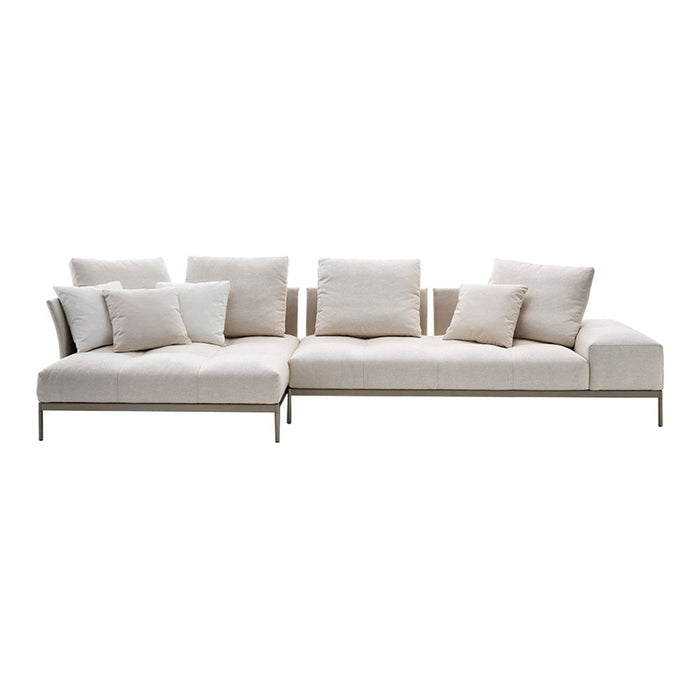 Modern beige sectional sofa with plush white and cream cushions, featuring a clean, minimalist design.
