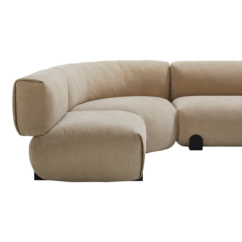 Beige curved sofa with a smooth, textured fabric and minimalist black accents. Modern and stylish design.