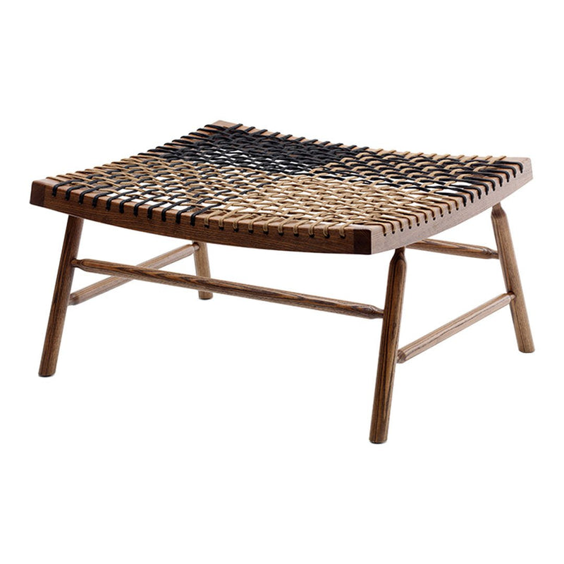 Woven black, brown, and natural tones on a wooden frame, creating a geometric pattern for modern decor.
