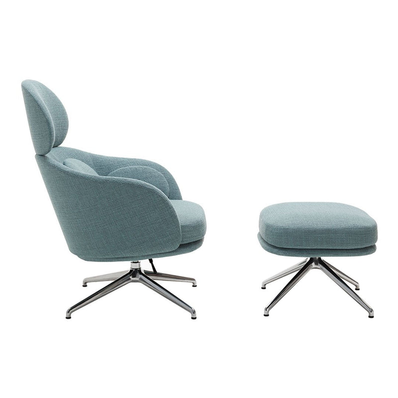 Elegant light blue armchair and matching ottoman with smooth, modern upholstery and sleek chrome accents.