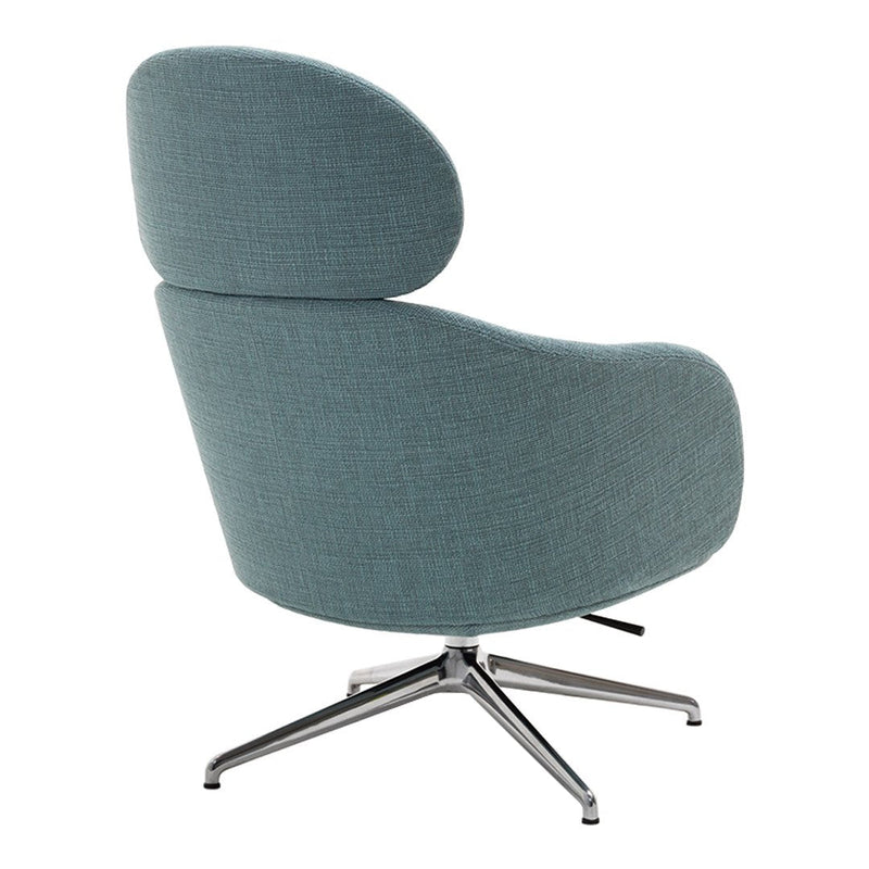 Stylish curved chair in soft teal fabric with a sleek chrome base. Modern design with minimalist aesthetic.