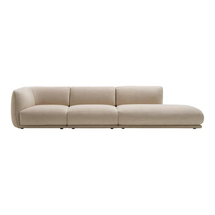 Light beige sectional sofa with a smooth, minimalist design and clean lines, perfect for modern interiors.