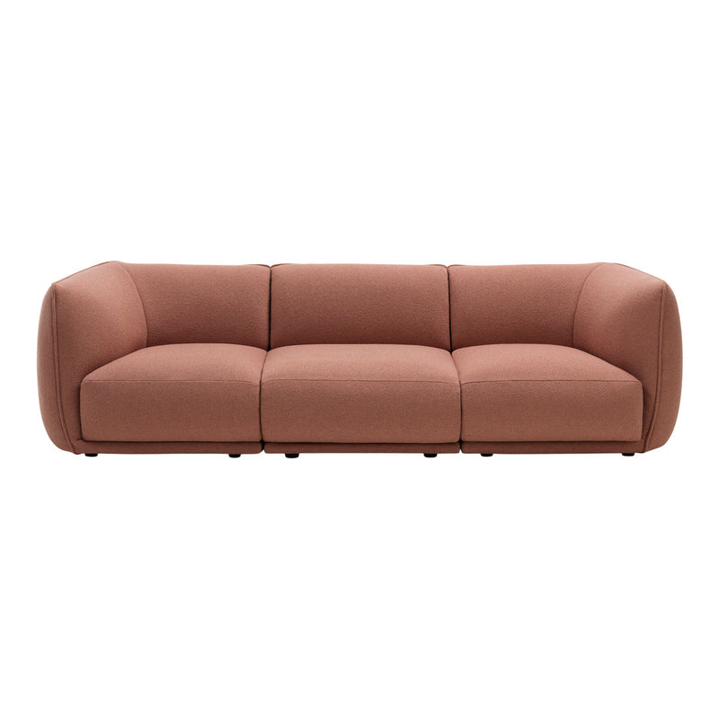 Rose-colored modern sofa with a smooth, minimalist design and soft, rounded edges. Perfect for contemporary decor.
