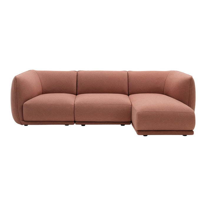 Modern L-shaped sofa in soft terracotta fabric with a clean, minimalist design. Perfect for contemporary living spaces.