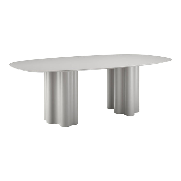 Light gray oval dining table with fluted column legs, featuring a smooth finish and minimalist design.