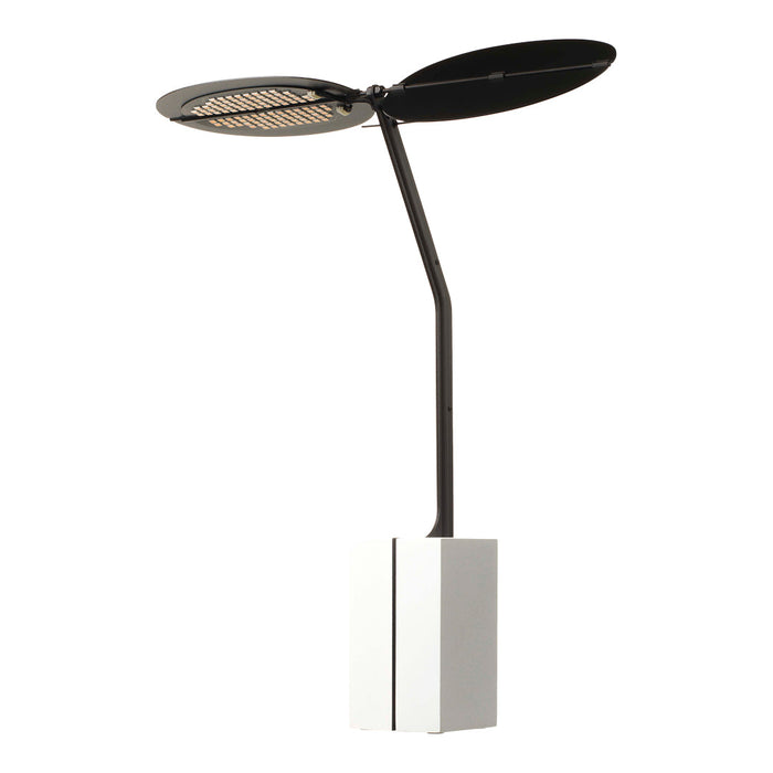 Modern black and white lamp with a sleek design and circular shade, featuring a subtle grid pattern.