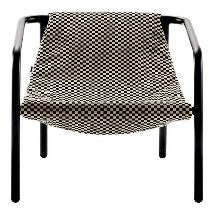 "Black and cream checkered lounge chair with a sleek metal frame for modern decor."