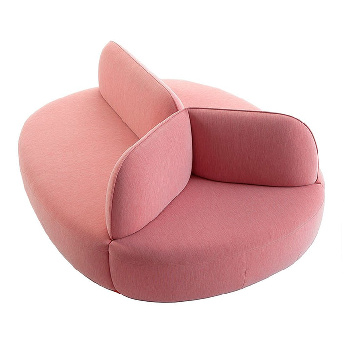 Stylish pink lounge chair with smooth, rounded contours and minimalistic design, perfect for modern interiors.