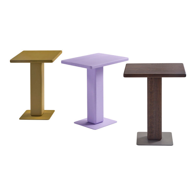 Set of three modern side tables in gold, lavender, and dark wood tones with sleek square tops and bases.