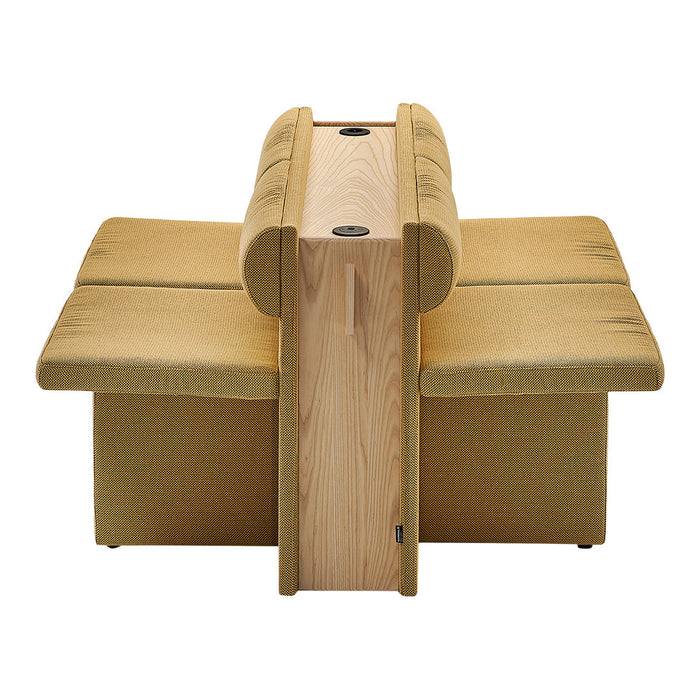 Mustard yellow fabric sofa with a textured pattern and light wood accents. Ideal for modern interior décor.