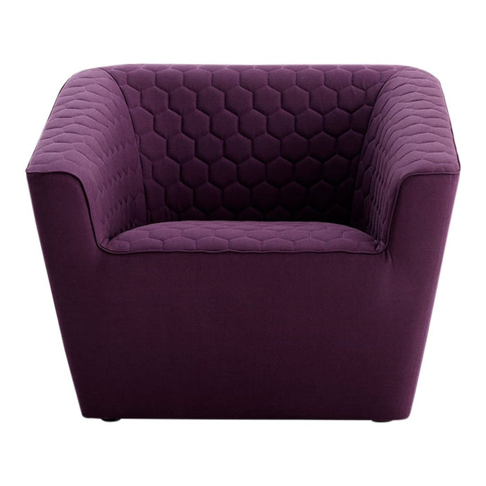 Plush purple chair with a hexagonal patterned backrest, perfect for modern decor.