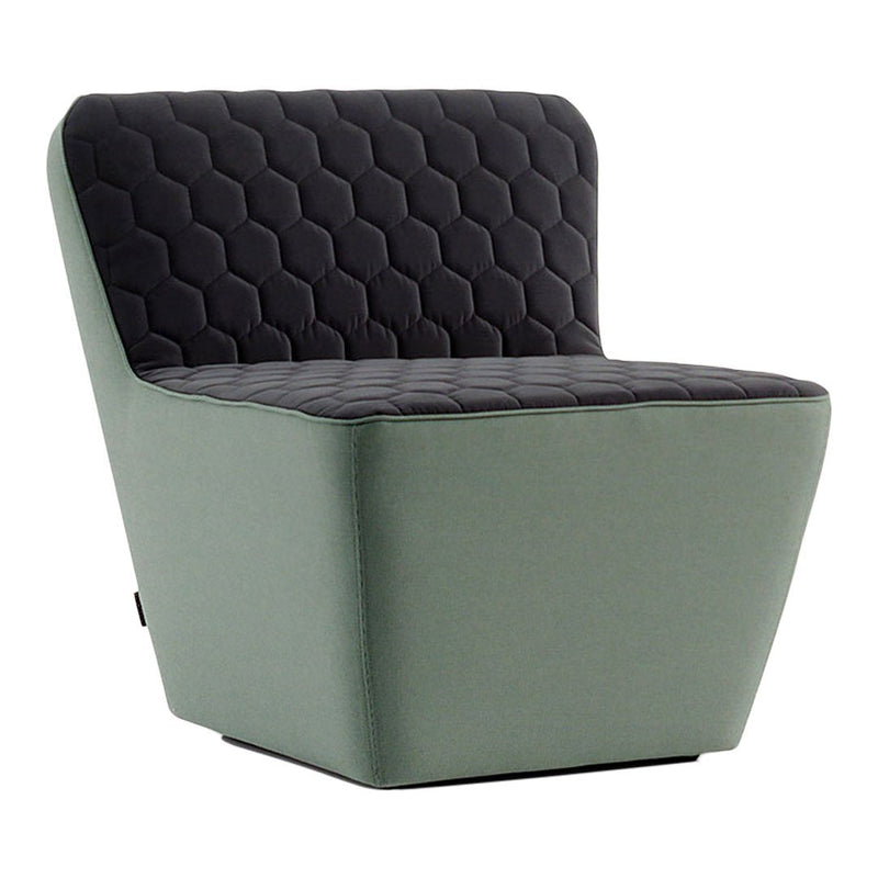 Modern chair featuring a quilted black seat and soft green base, combining geometric textures for a stylish look.