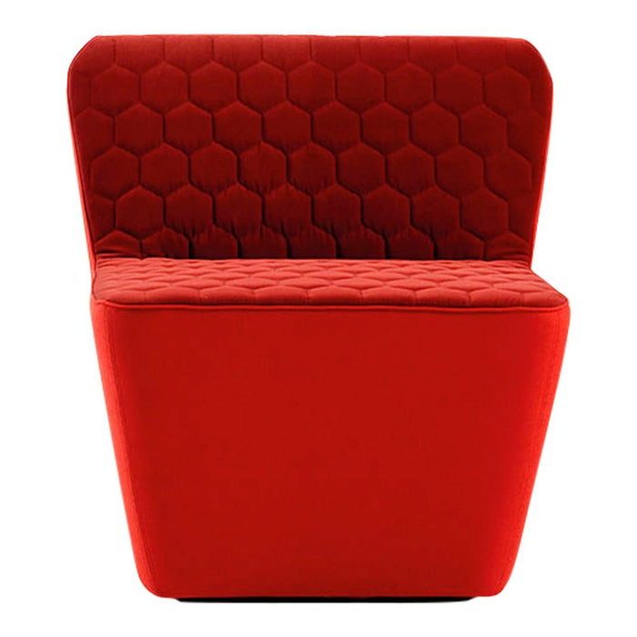 Red upholstered chair with a hexagonal pattern on the backrest and quilted texture on the seat.