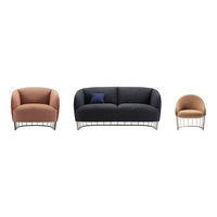 "Set of three plush sofas in soft coral, deep navy, and warm beige, featuring sleek metal bases and modern patterns."