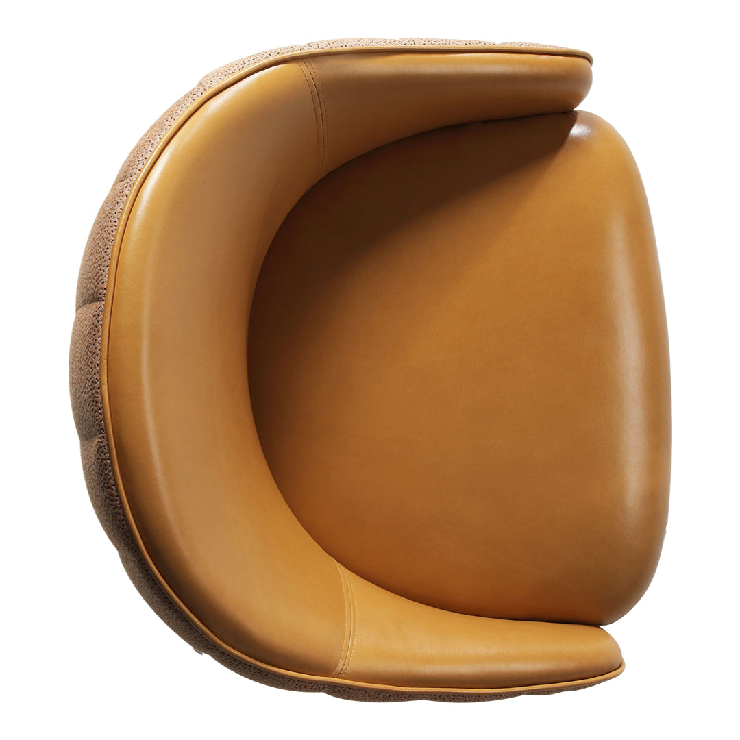 Tan leather chair with a smooth finish and rounded edges, featuring a subtle textured pattern along the base.