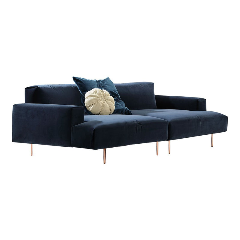 Navy blue modern sofa with plush cushions and sleek wooden legs, featuring a textured light-colored accent pillow.
