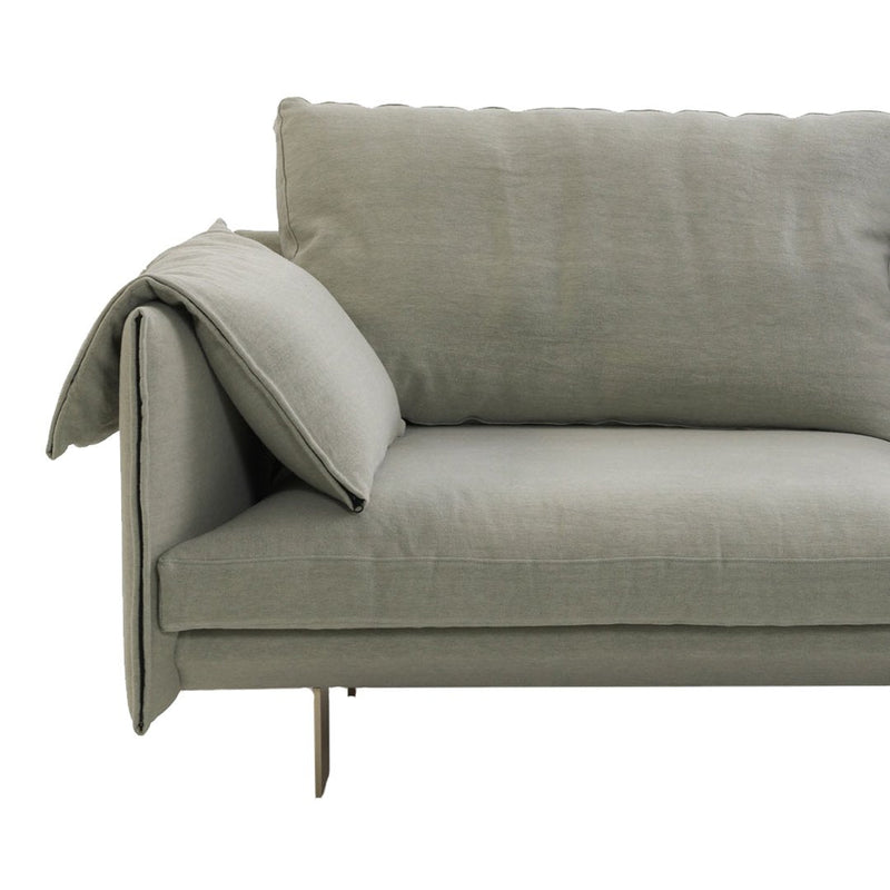 Light gray sofa with a smooth texture and minimalistic design, featuring a folded armrest and sleek metal legs.
