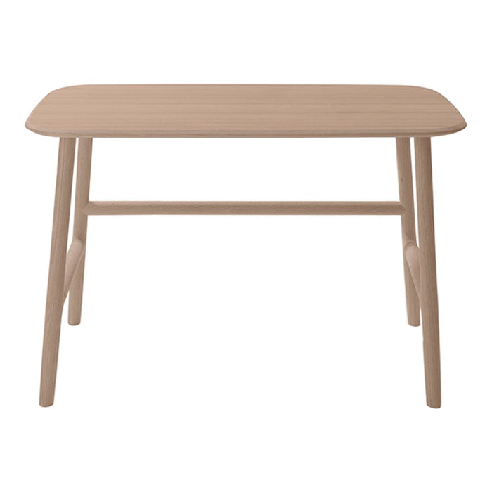 Natural wood dining table with a smooth, light beige finish and minimalist design, perfect for modern interiors.