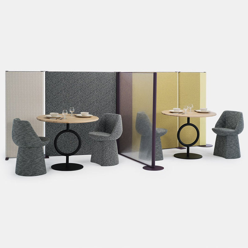 Gray and purple patterned partitions with yellow accents, paired with round tables and textured seating in neutral tones.
