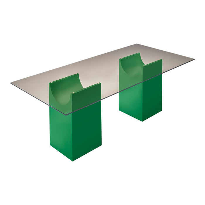 Modern glass table with green geometric bases, featuring a sleek, clear tabletop for a contemporary look.