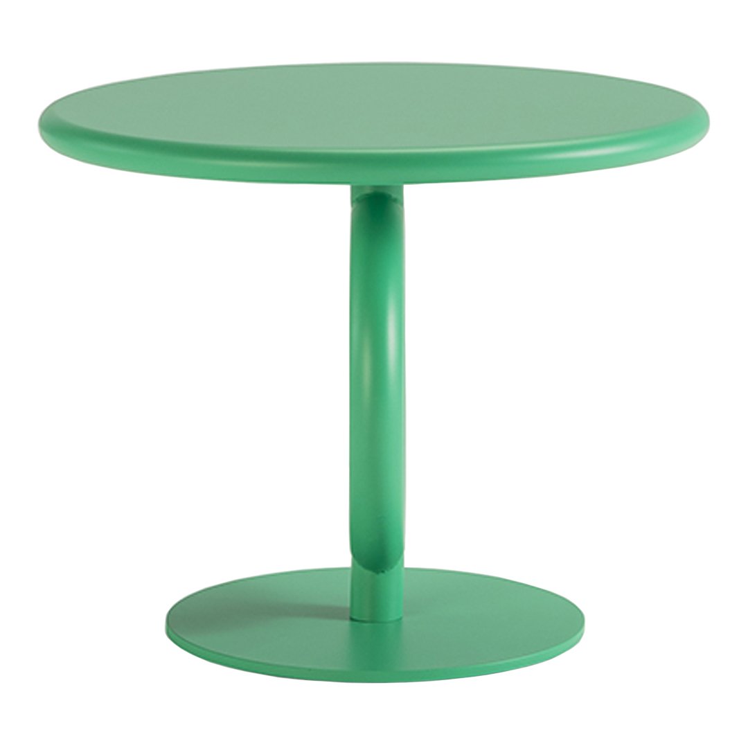 Round green table with a glossy finish and smooth, modern design, perfect for any contemporary space.