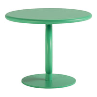 Round green table with a glossy finish and smooth, modern design, perfect for any contemporary space.