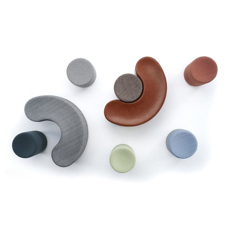 Colorful geometric shapes in gray, brown, green, blue, and terracotta with smooth patterns on a white background.