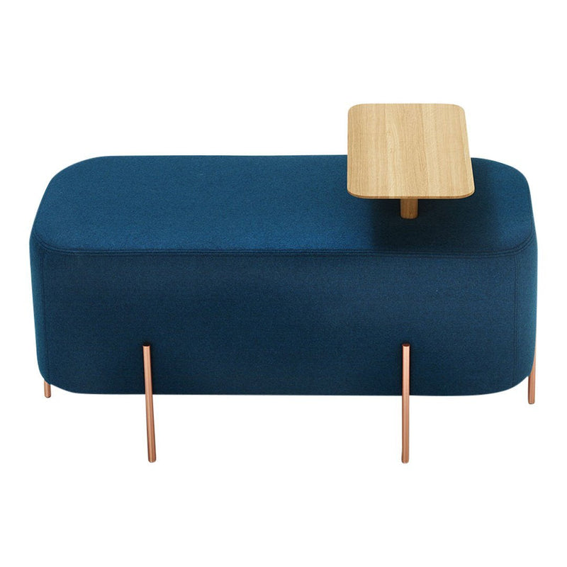 Stylish blue upholstered ottoman with a light wood accent table and copper legs. Modern minimalist design.