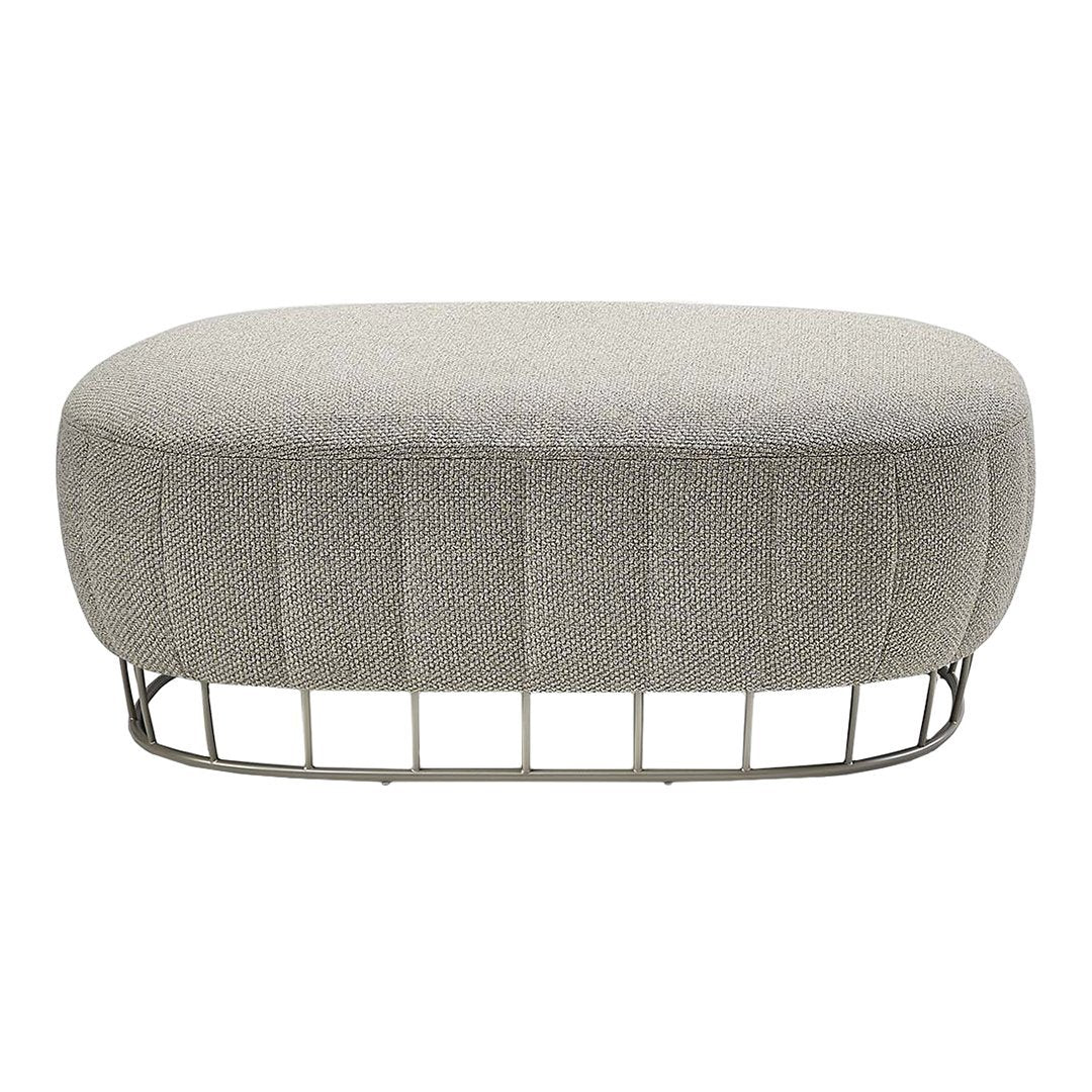 Gray upholstered oval ottoman with a textured pattern and a sleek metal base. Ideal for modern decor.