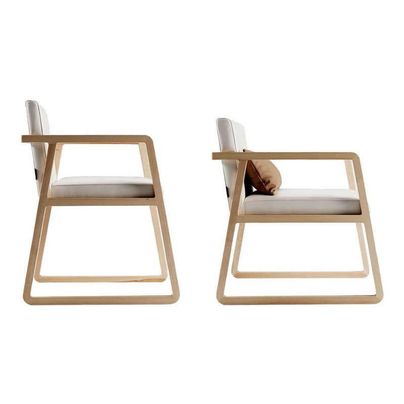 Modern light wood armchair with a clean white cushion and minimalist design, featuring natural wood grain patterns.