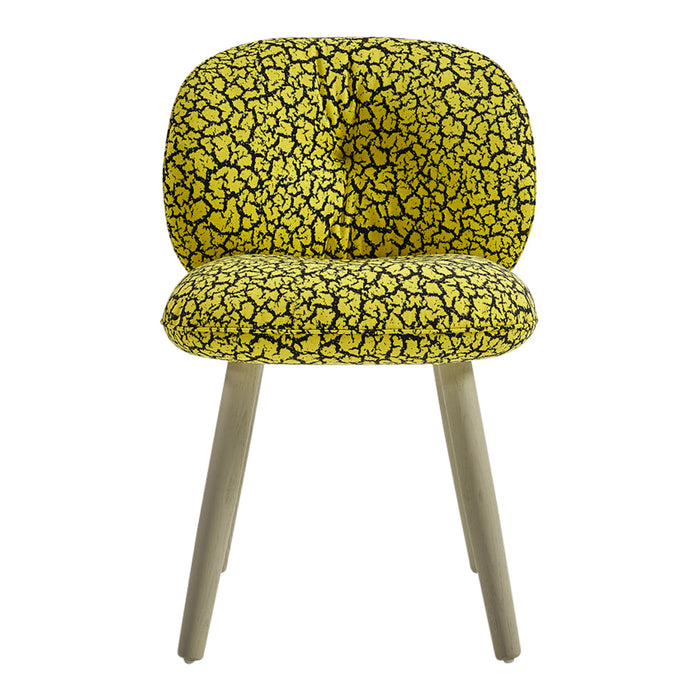 Yellow upholstered chair with a black abstract pattern and light wooden legs. Perfect for modern decor.