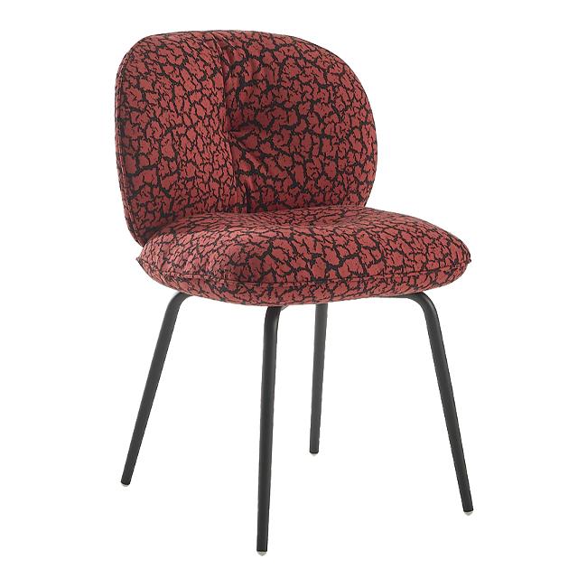Red and black patterned chair with a textured, abstract design, featuring slender black legs.