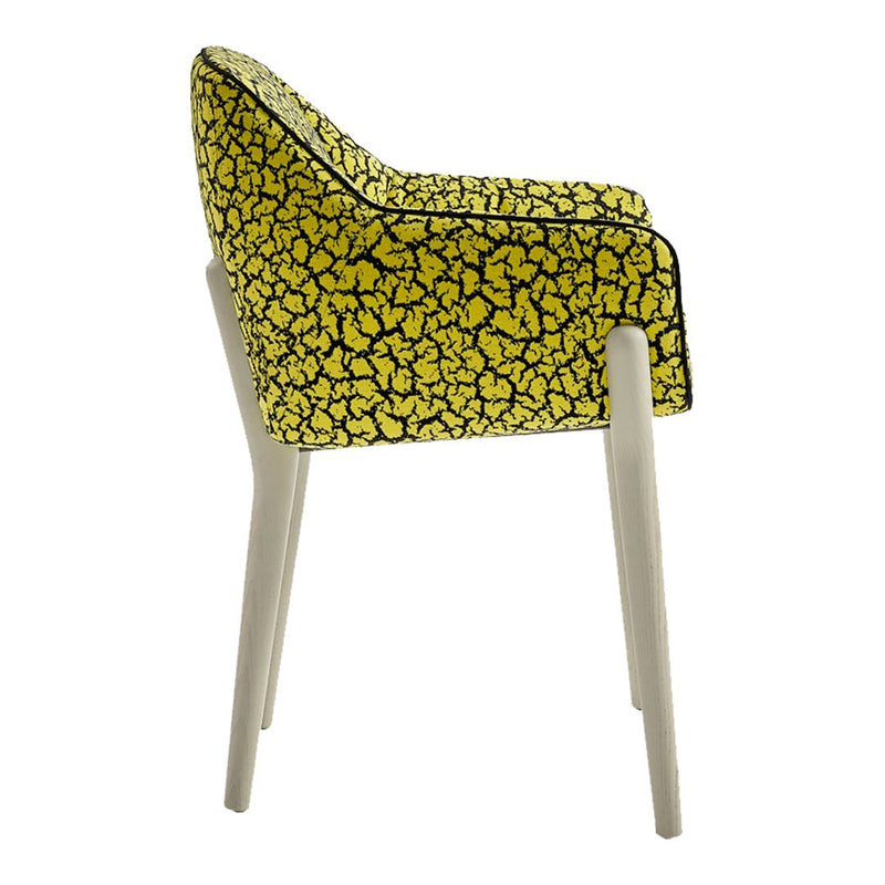Yellow patterned chair with a floral design and light-colored legs, showcasing a vibrant and modern aesthetic.