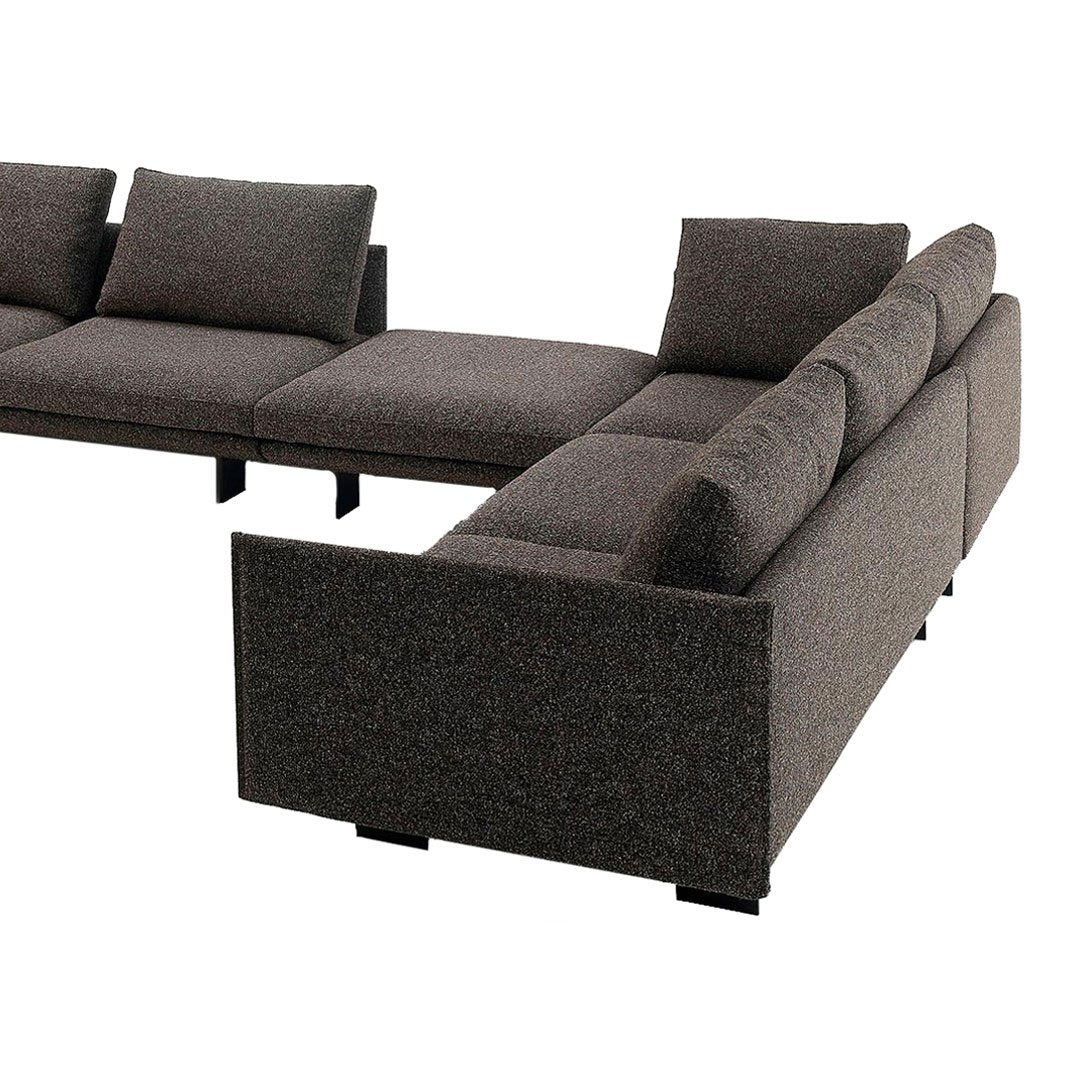 Gray sectional sofa with a textured fabric and clean lines, suitable for modern living spaces.