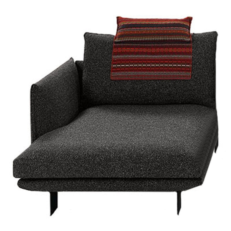 Black textured chaise lounge with colorful striped accent pillow. Modern, minimalist design. Perfect for contemporary spaces.