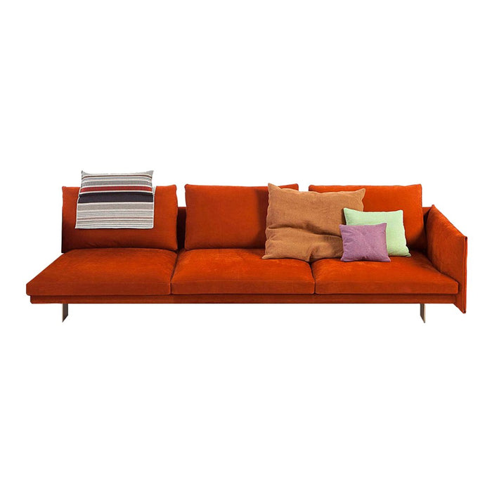 Vibrant orange sofa with multicolored pillows in pastel purple, green, and striped patterns, perfect for modern decor.
