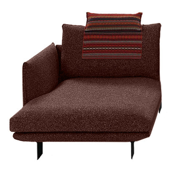 Brown lounge chair with a textured fabric and a striped, multicolored throw pillow on top.
