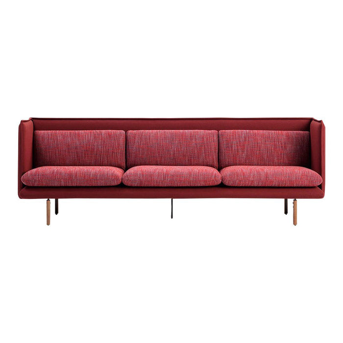 Red fabric sofa with a textured pattern and wooden legs, offering a modern and stylish accent for any living space.