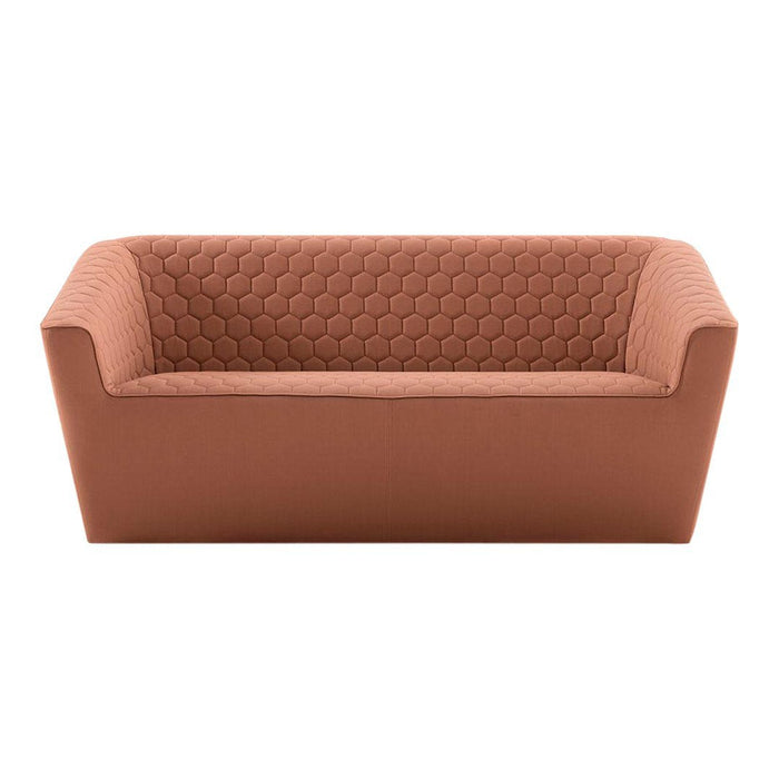 Rust-colored sofa with a textured honeycomb pattern for a modern, stylish look. Ideal for contemporary interiors.
