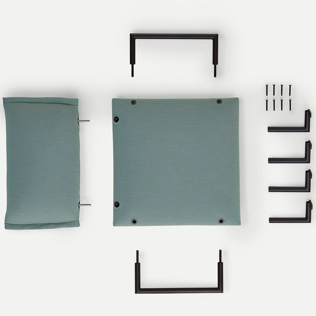 Light teal cushion and seat pad with black metal hardware and accents, featuring a minimalist design.