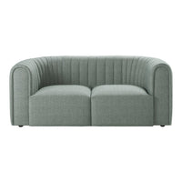 Light gray curved sofa with vertical ribbed texture and minimalist design, perfect for modern interiors.