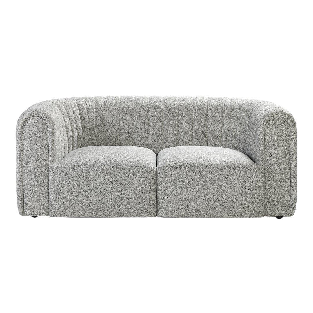 Gray curved sofa with vertical ribbed pattern and plush cushioning for modern decor.