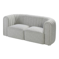 Light gray curved sofa with vertical ribbed pattern, featuring a modern and minimalist design.