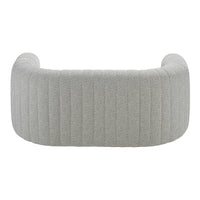Soft gray upholstered couch with vertical ribbed pattern, creating a modern and stylish look. Perfect for contemporary decor.