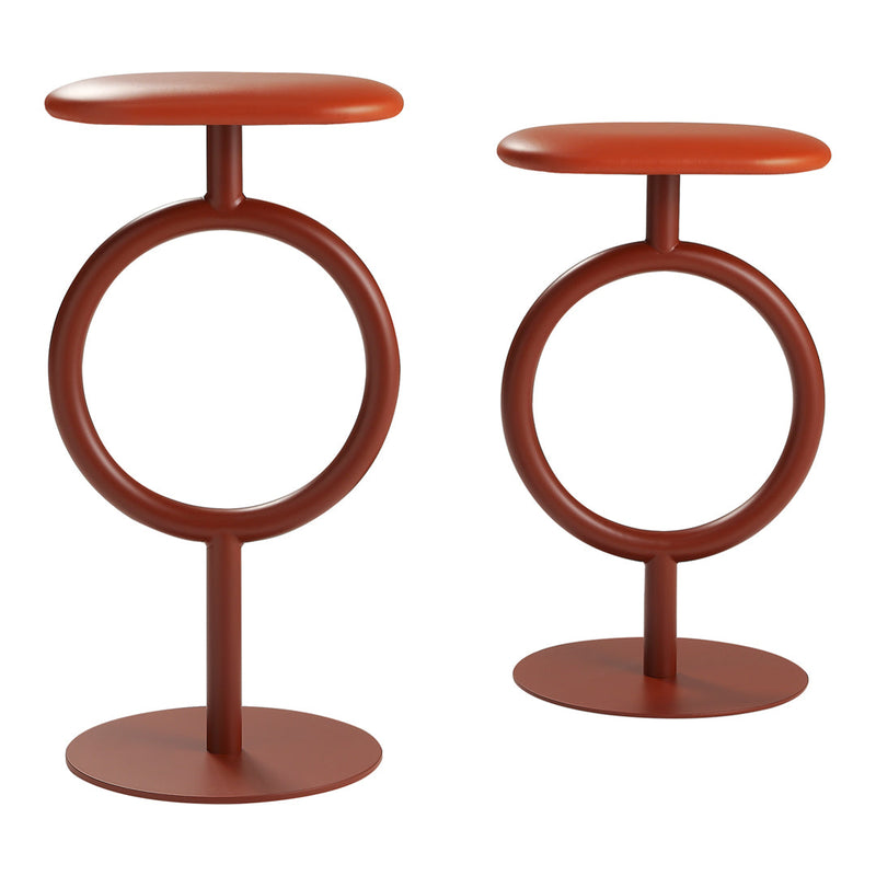 Modern stools in warm terracotta, featuring a circular base and minimalist design for a contemporary look.