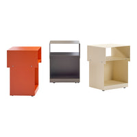 Colorful set of three modern side tables: bright orange, sleek gray, and soft beige with minimalist patterns.