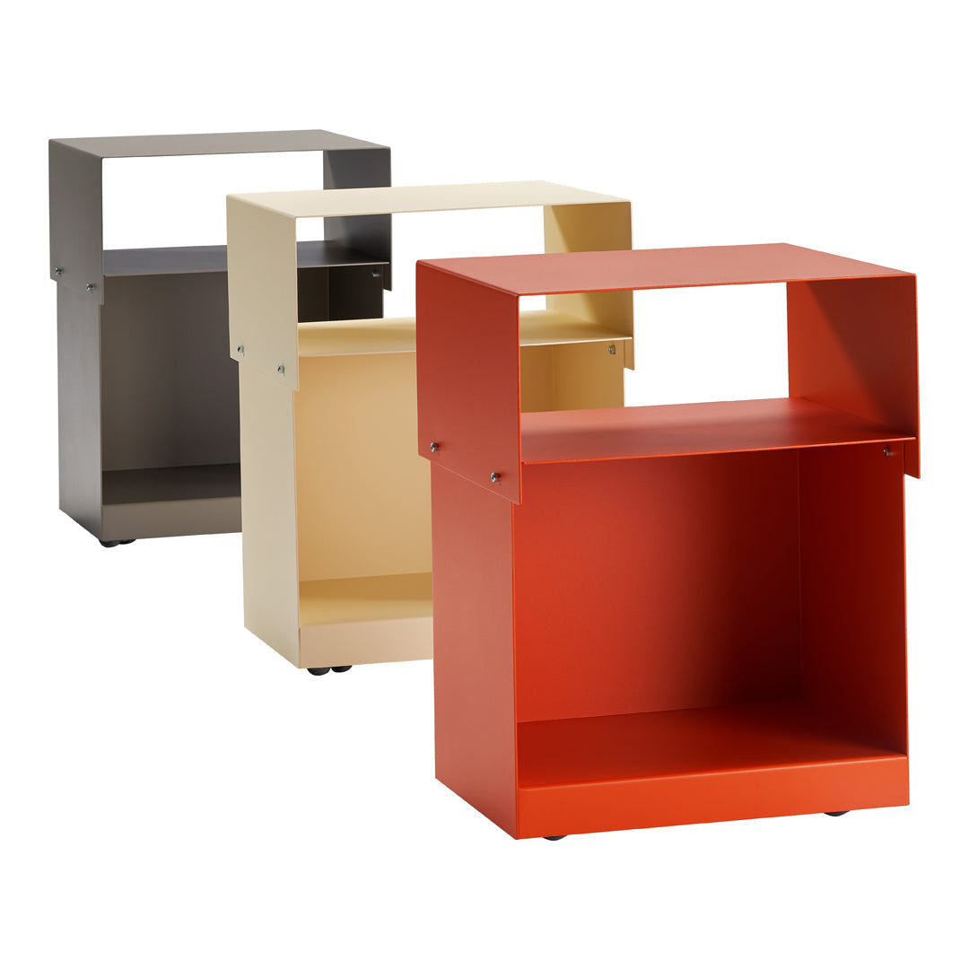 Modern storage cubes in gray, cream, and vibrant red colors with a minimalist design.